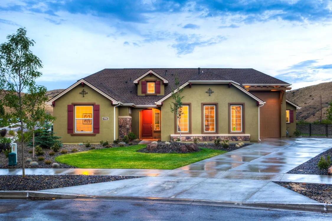 Residential home with architectural shingles and landscaped front yard