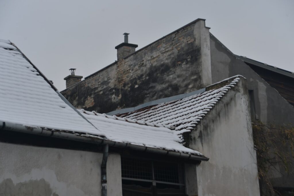 Building with storm damage requiring emergency roof repair